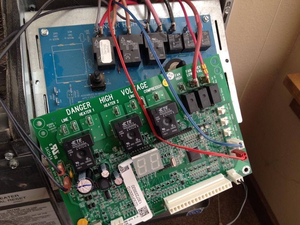 A furnace control board with relays and wiring