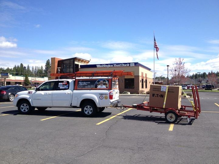 The pickup towing a trailer with a boxed Eaton delivery